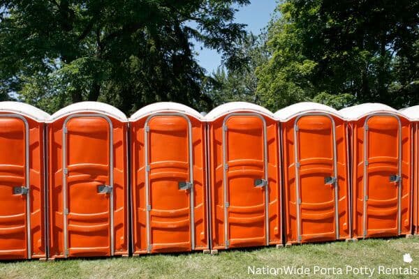 a lineup of clean and well-maintained portable loos for workers in Blissfield, MI