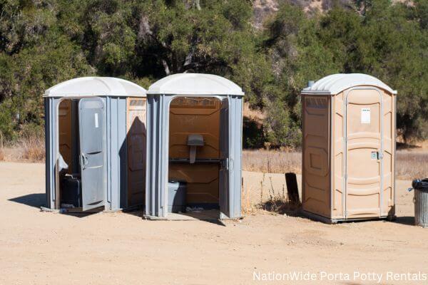 a clean row of portable restrooms for outdoor weddings or festivals in Newberry, MI